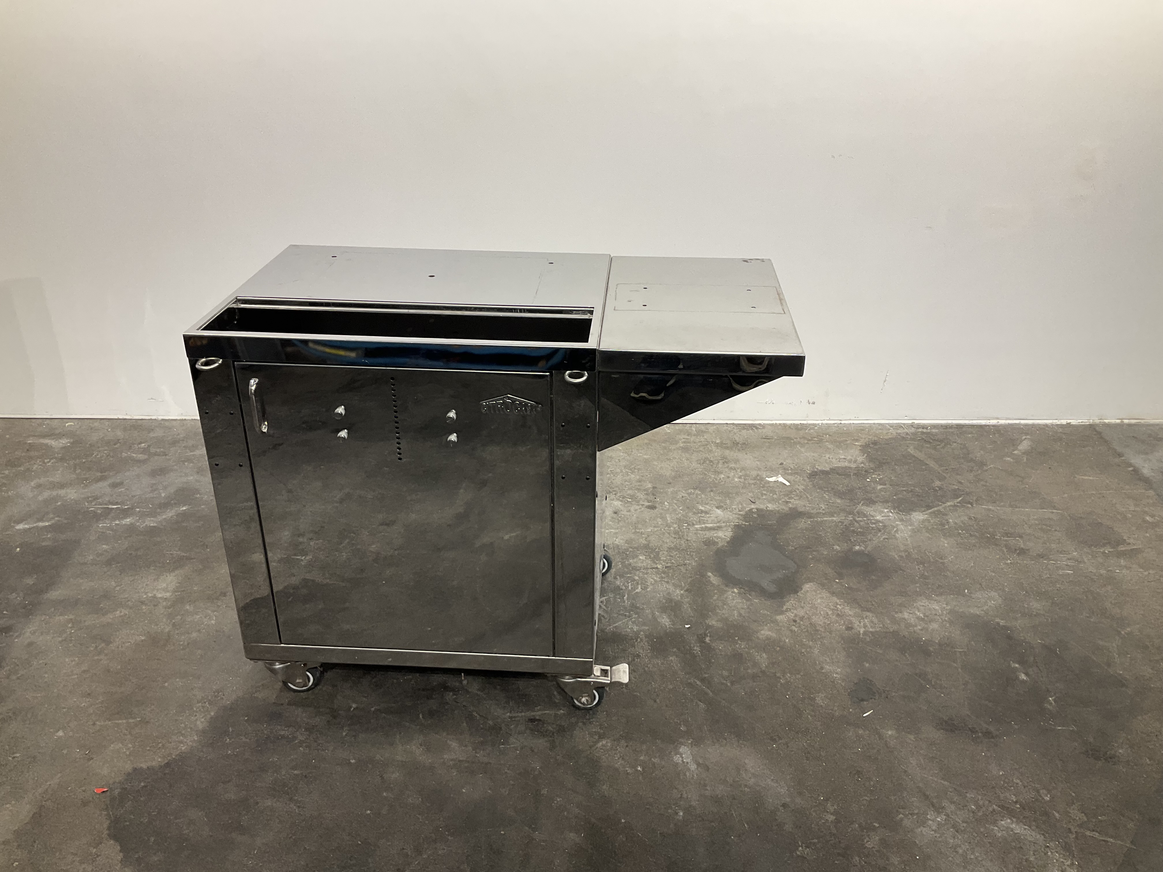 Stainless steel table / stainless steel cabinet on castors, used